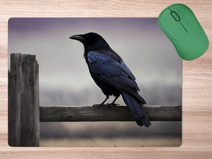 Crow perched on a weathered wooden fencemousepad mockup style 5