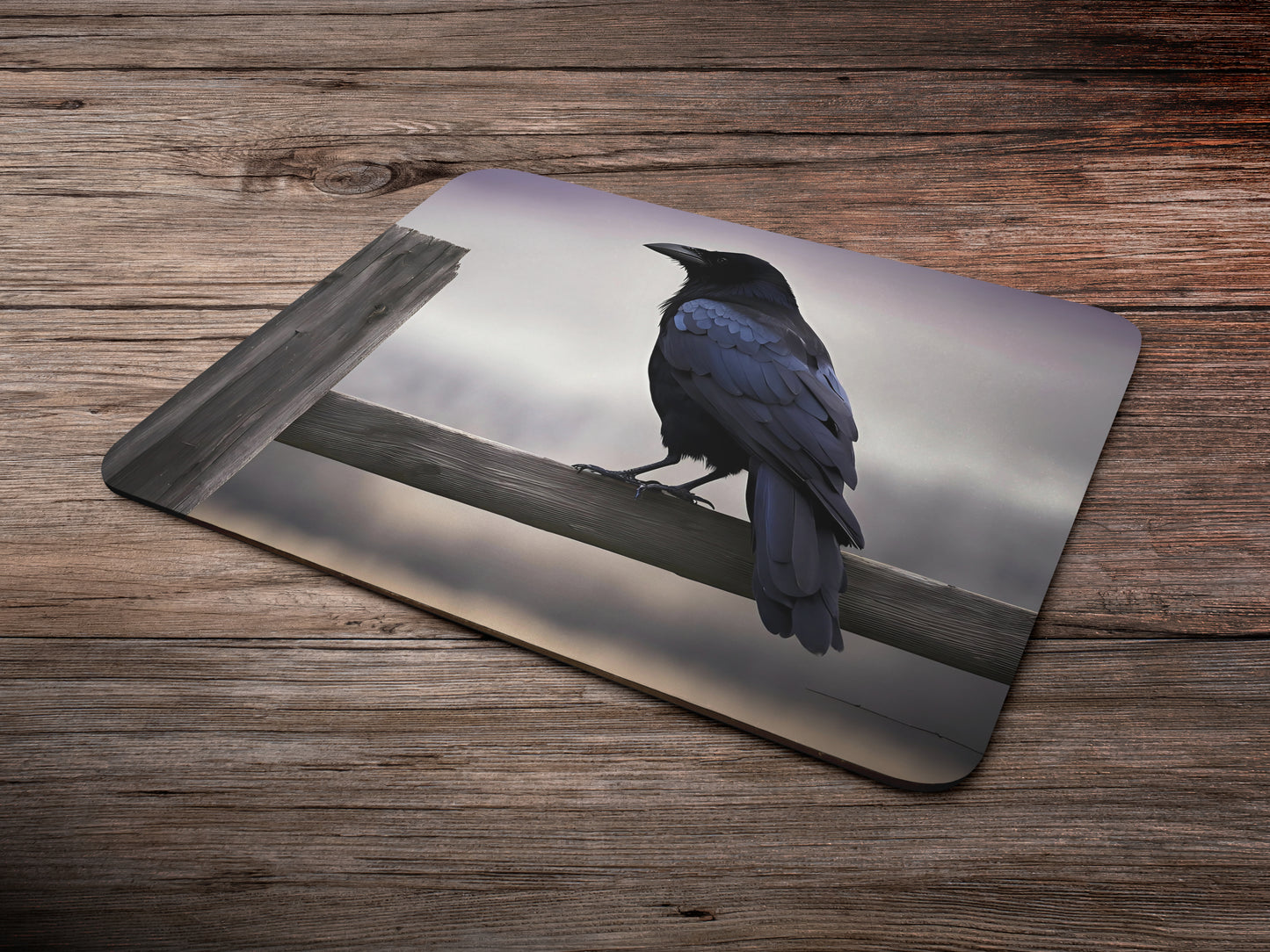 Crow perched on a weathered wooden fencemousepad mockup style 6